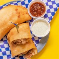Shredded Beef Criolla Empanadas · A deep fried sweet corn dough wraps the most delicious fillings.