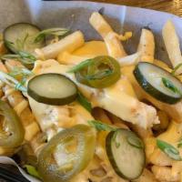 Cheese Fries · Handmade cheese sauce melted on French fries.