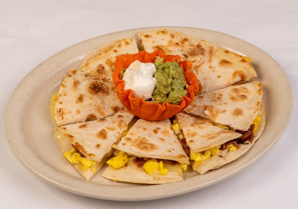Breakfast Quesadilla · Our delicious Quesadilla made with Bacon and Egg and Cheese!  Big enough to share.  Make sure to add Queso for dipping! Served with Guacamole and Sour Cream