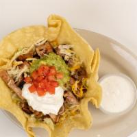 Chicken Fajita Taco Salad · A bed of Lettuce topped with chicken fajita meat, tomatoes, cheddar cheese, monterrey jack c...