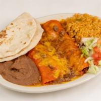 Beef Enchiladas · Two beef enchiladas with chili con carne.