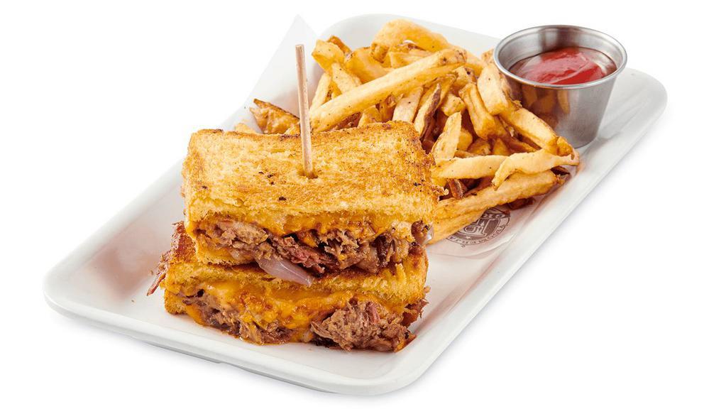 Texan Melt · Smoked Brisket, Honey BBQ Sauce, Caramelized Onions, Jack and Cheddar Cheese melted on Brioche Bread