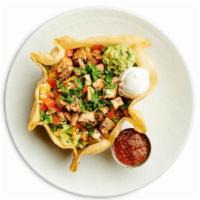 Combo Taco Salad · Fajita Chicken and Beef, Tomatoes, Mixed Jack and Cheddar Cheese, Sour Cream, Guacamole and ...