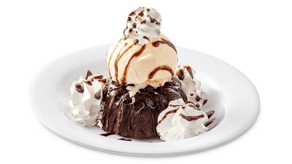 Molten Lava Cake · Chocolate Filled Cake, Topped with Hot Fudge and Served with Vanilla Ice Cream and Whipped Cream