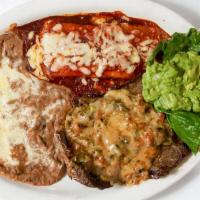 Tampiqueña Steak · Steak served with green chile strips one enchilada, guacamole and refried beans.