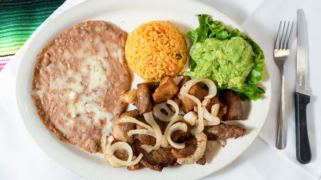 Carnitas · Served with French fries or refried beans, guacamole, Spanish rice, green onions and our special chile sauce.