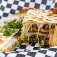 Quesadillas · Steak, chicken, or brisket grilled to perfection inside two homemade flour tortillas stuffed...