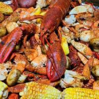 Ultimate Pot · 4 lbs crawfish, 1 lb boiled shrimp, pieces of king crab, snow crab, and Dungeness crab serve...