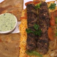 Beef Chapli Kebab Dinner · Spicy Ground Beef Kebabs served with rice, paratha bread and veggies