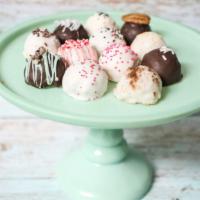Half Dozen Cake Balls  · The perfect bite-size ball of cake and icing rolled and dipped in chocolate and complemented...
