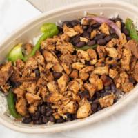 Grilled Chicken · Served in a bowl on a bed of shredded lettuce topped with beans corns salsa sour cream chees...