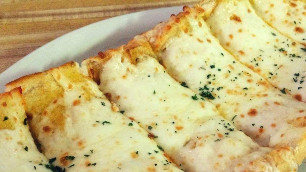 Garlic Cheese Bread · Homemade Garlic Bread, topped with Mozzarella and Served with a Side of Marinara Sauce