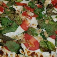 Special White Pizza · Ricotta, mozzarella cheese, spinach, tomatoes and fresh garlic.