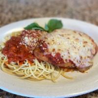 Chicken Parmigiana · Crispy Chicken Breast, topped with marinara and Melted Mozzarella. Served with Spaghetti Mar...