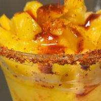 Mangonada · Mango slush topped with fresh diced mango also drizzled with chamoy and tajin.