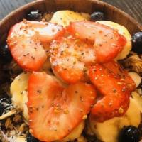 Heart Bowl · Cherry, banana, maca, and almond milk; topped with granola, sliced almonds, coconut flakes, ...