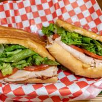 Turkey & Cheese · Turkey, Swiss cheese, mayo, lettuce, & tomatoes on pressed authentic Cuban bread.