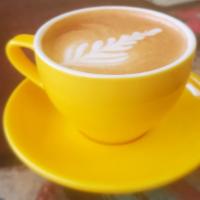Cortado · Double shot of espresso, espresso whipped sugar, milk steamed to perfection in a 12 oz cup