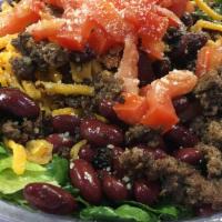 Catalina Salad · Green leaf lettuce, hamburger, kidney beans, fritos, cheddar cheese, tomatoes, catalina dres...