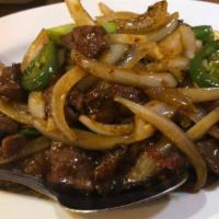 Mongolian Beef · Dry stir fry Shredded beef ,jalapeño, onions and green onions , chili peppers. Spicy