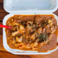 Nola' Shrimp & Grits · Organic, creamy grits smothered in a home-made creole shrimp sauce with sautéed shrimp, ando...