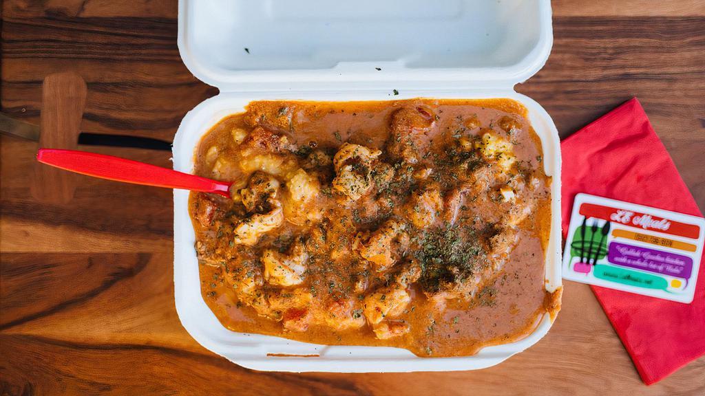 Nola' Shrimp & Grits · Organic, creamy grits smothered in a home-made creole shrimp sauce with sautéed shrimp, andouille sausage and minced veggies.

2 Shrimp (For One)
4 Shrimp (For Two)