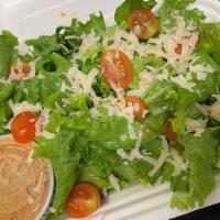 Nola House Salad · A medley of romaine and red leaf lettuce. Topped with freshly baked croutons, organic red to...