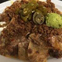Nachos Supreme · Your choice of chicken or beef with refried beans and cheese. Served with sour cream, guacam...