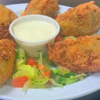 Stuffed Jalapeños · 6 large jalapeños stuffed with chicken and cheese. Served with ranch and chile con queso.