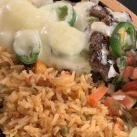 Steak Jalapeño · Carne asada topped with fresh jalapeños and melted monterey cheese. Served with rice, refrie...