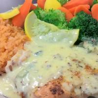 Salmon · 8 oz. Grilled salmon topped with a pecan sauce. Served with rice and charro beans.