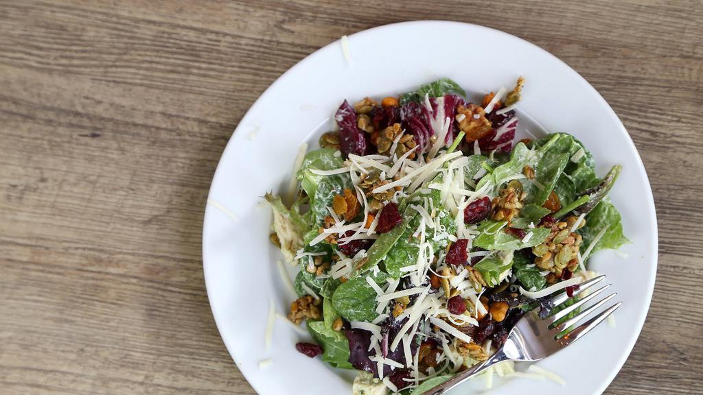 Yardbird Salad · Mixed greens, chicken, spiced seeds and nuts, roasted chickpeas, golden raisins, and parmesan cheese topped with house-made avocado goddess dressing. / 550-640 cal.