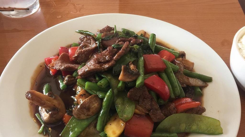 Paht Kapao (Stir Fry With Basil) · Onions, bell pepper, mushrooms, jalapeño, green beans, zucchini, snow peas and basil stir fried in house sauce, Thai spicy sauce with meat choice