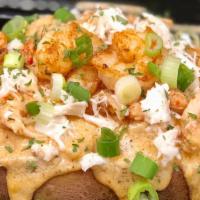 Mo’S Seafood Baked Potato · Baked potato topped with our authentic sauce, lump crab meat, shrimps, crawfish tails, green...