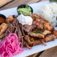  Fajitas · Grilled steak, chicken, or shrimp with sautéed peppers and onions, served with sour cream, g...