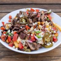 Carne Asada Nachos Or Fries · Grilled steak, choice of tortilla chips or fries, melted poblano cheese sauce, pico de gallo...