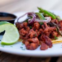 Al Pastor Taco · Marinated pork, grilled onion, cilantro