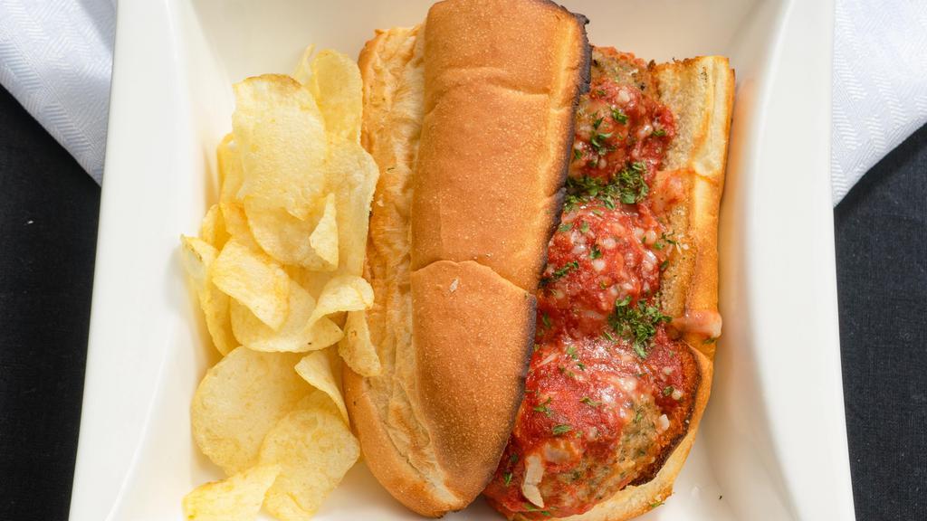 Meatball Parm Sub · Meatballs with Provolone Cheese and Marinara Sauce. Served on toasted Costanzo Bakery Sub Rolls, and served with chips.