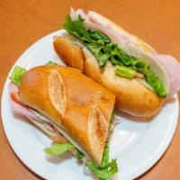 Italian Sub · Pepperoni, ham, salami with lettuce tomato and onion. Served on toasted costanzo bakery sub ...