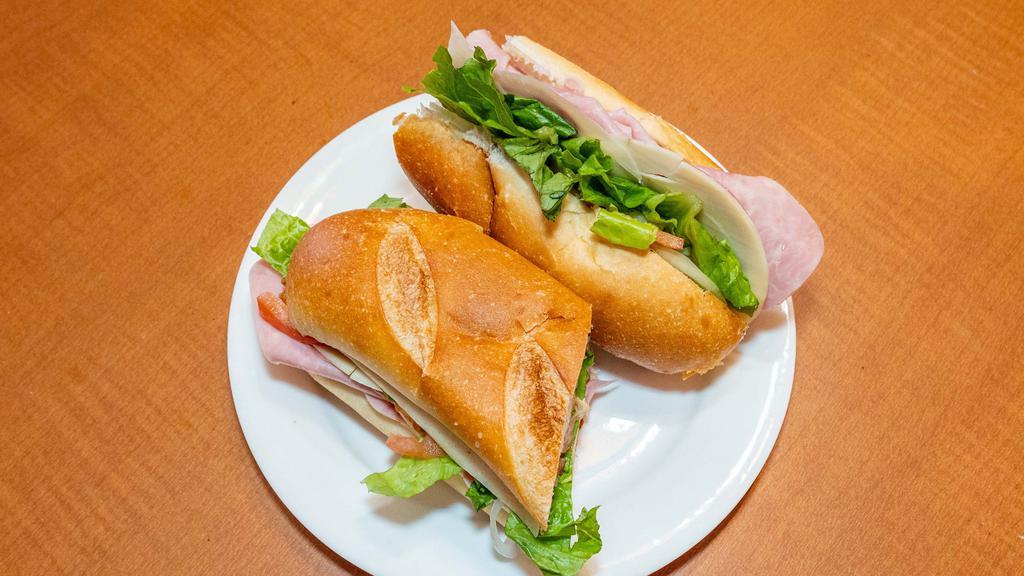 Italian Sub · Pepperoni, ham, salami with lettuce tomato and onion. Served on toasted costanzo bakery sub rolls and served with chips.