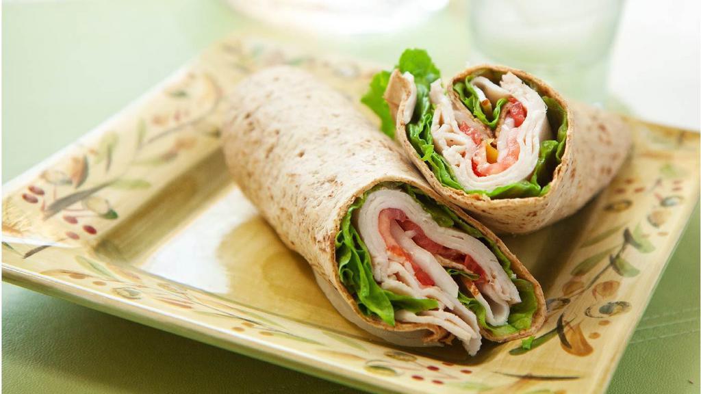 Turkey Wrap · Avocado, lettuce, cheese, onion, tomato, pickles, bacon, ranch or chipotle mayo.