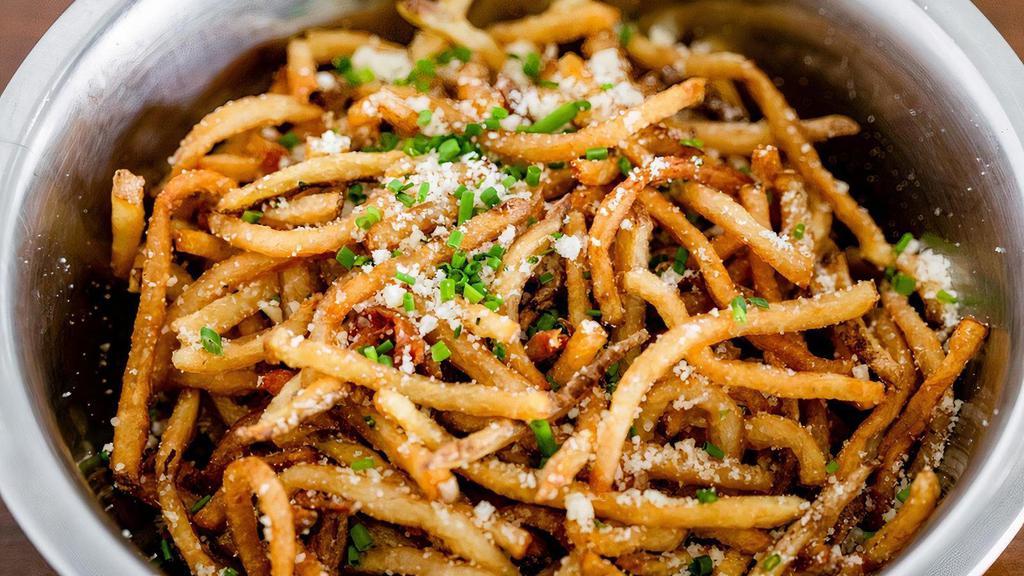 Truffle Fries (To Share) · House fries tossed with Truffle Oil, Parmesan Cheese, Chives, Salt