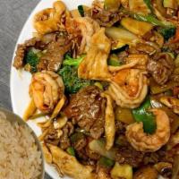 Three Delight · Shrimp, beef and chicken sauteed Chinese greens in brown sauce.