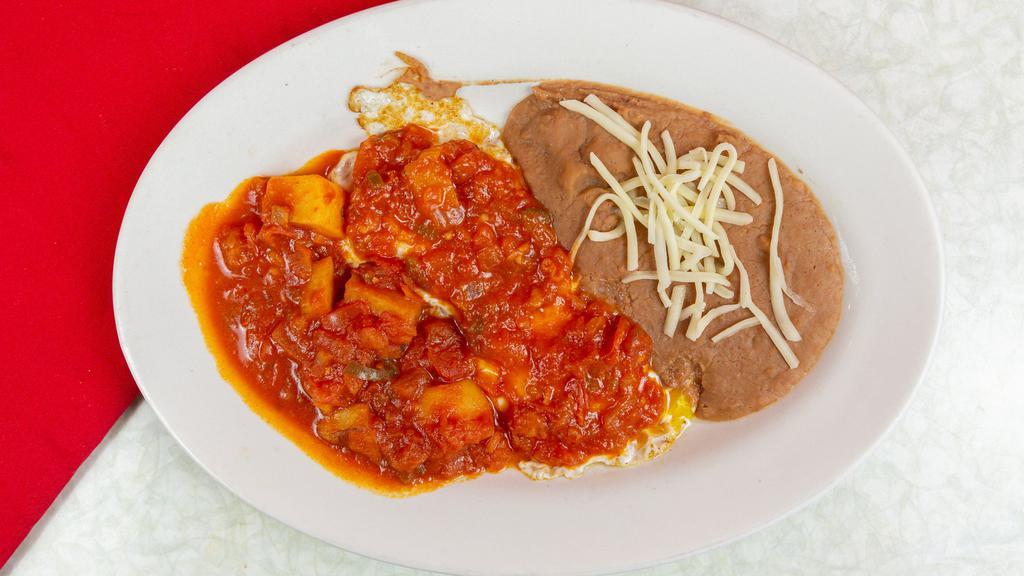 Huevos Revueltos · Choose ham, sausage, potato, bacon, chorizo or nopales with scrambled eggs.