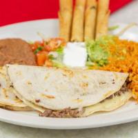 Plato Combinado · Two chicken flautas and two beef quesadillas served with tomato guacamole and sour cream.