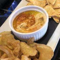 Hummus · Our healthy Mediterranean dip served with pita and housemade chips.