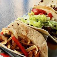 Street Tacos · Three flour tortilla stuffed with your choice of chicken, with onion and peppers, pulled por...
