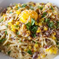 *Roasted Corn Carbonara · Spaghetti, bacon, roasted corn, pecorino, garlic breadcrumbs, and egg. *Consuming raw or und...