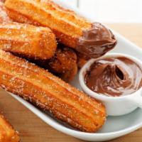 Cajeta (Caramel) Filled Churros (4Pc) · Made from a gluten based dough with eggs and milk, our delicious churro batter is piped fres...