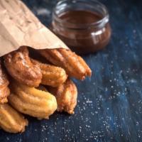 Chocolate Peanut Butter Churros (2Pc) · For all the chocolate and peanut butter lovers out there! Made from a gluten based dough wit...